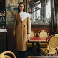 Aritzia models wearing neutral winter coats