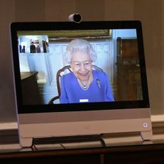 london, england december 10 queen elizabeth ii appears on a screen by videolink from windsor castle, where she is in residence, during a virtual audience to receive his excellency the high commissioner for brunei darussalam first admiral pengiran dato seri pahlawan norazmi bin pengiran haji muhammad and his wife, pg datin noralam binti pg hj kahar, who were at londons buckingham palace on december 10, 2020 in london, england photo by yui mok wpa poolgetty images