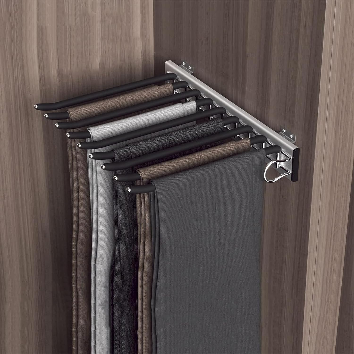 A black pants pull out rack in a wooden wardrobe