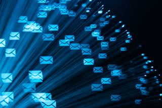 Business email compromise: Network Communications Concept with digitized email symbols on a blue background