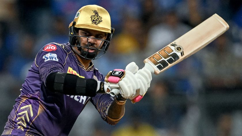 Kolkata Knight Riders&#039; Sunil Narine with his bat aloft in the May 2024 match against Mumbai Indians