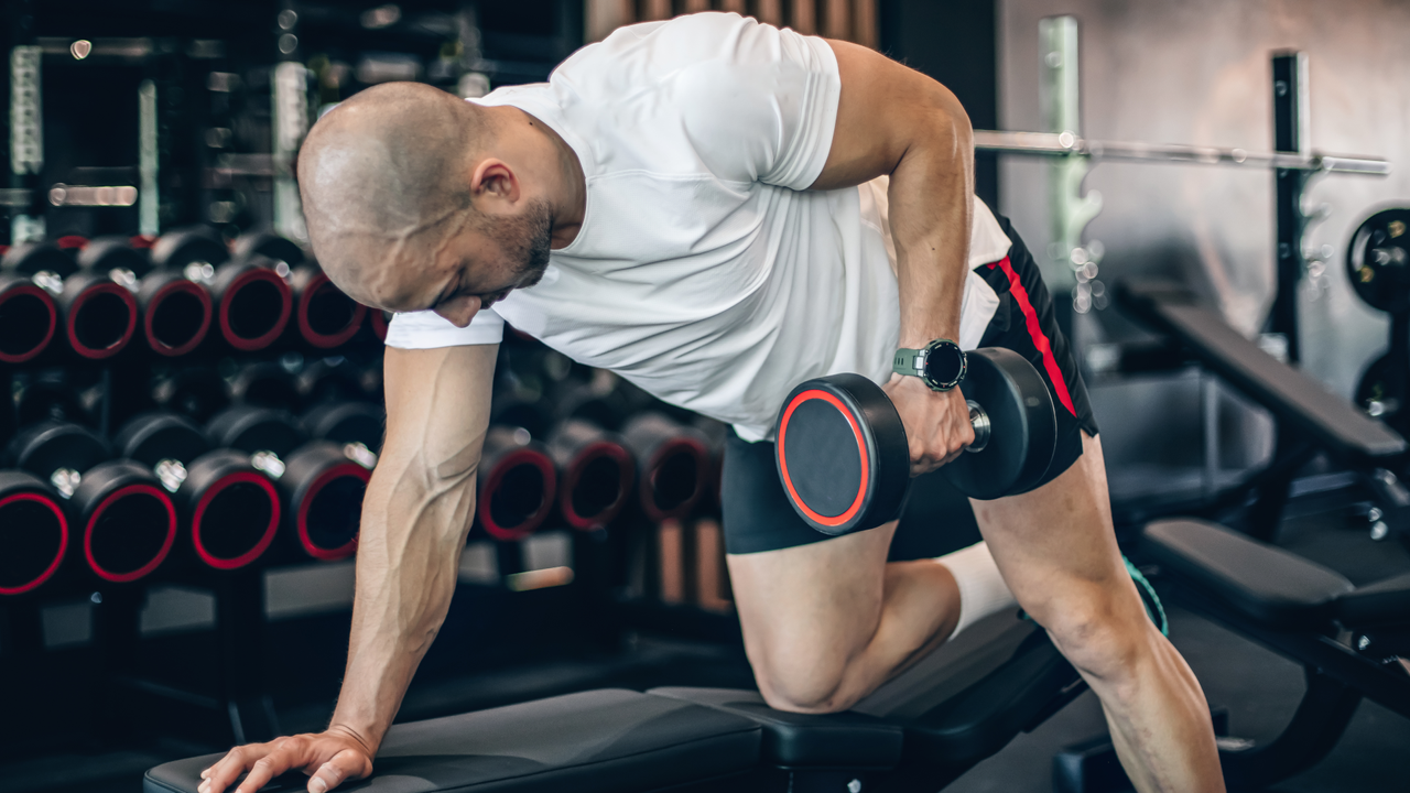 A man performing dumbbell rows