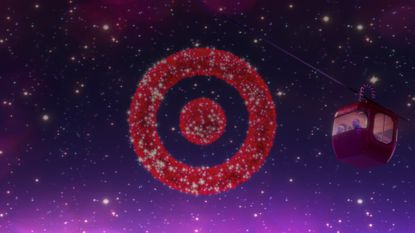 The Target logo displayed on a starry background with a funicular car to the right.
