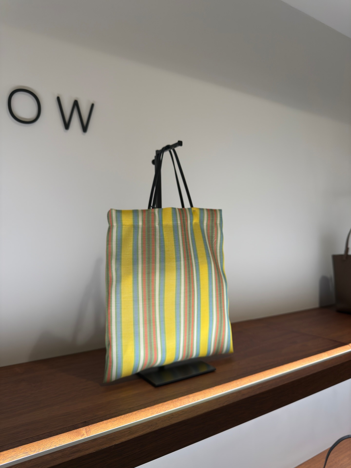 Photo of The Row Barn Bag hanging up in The Row store.