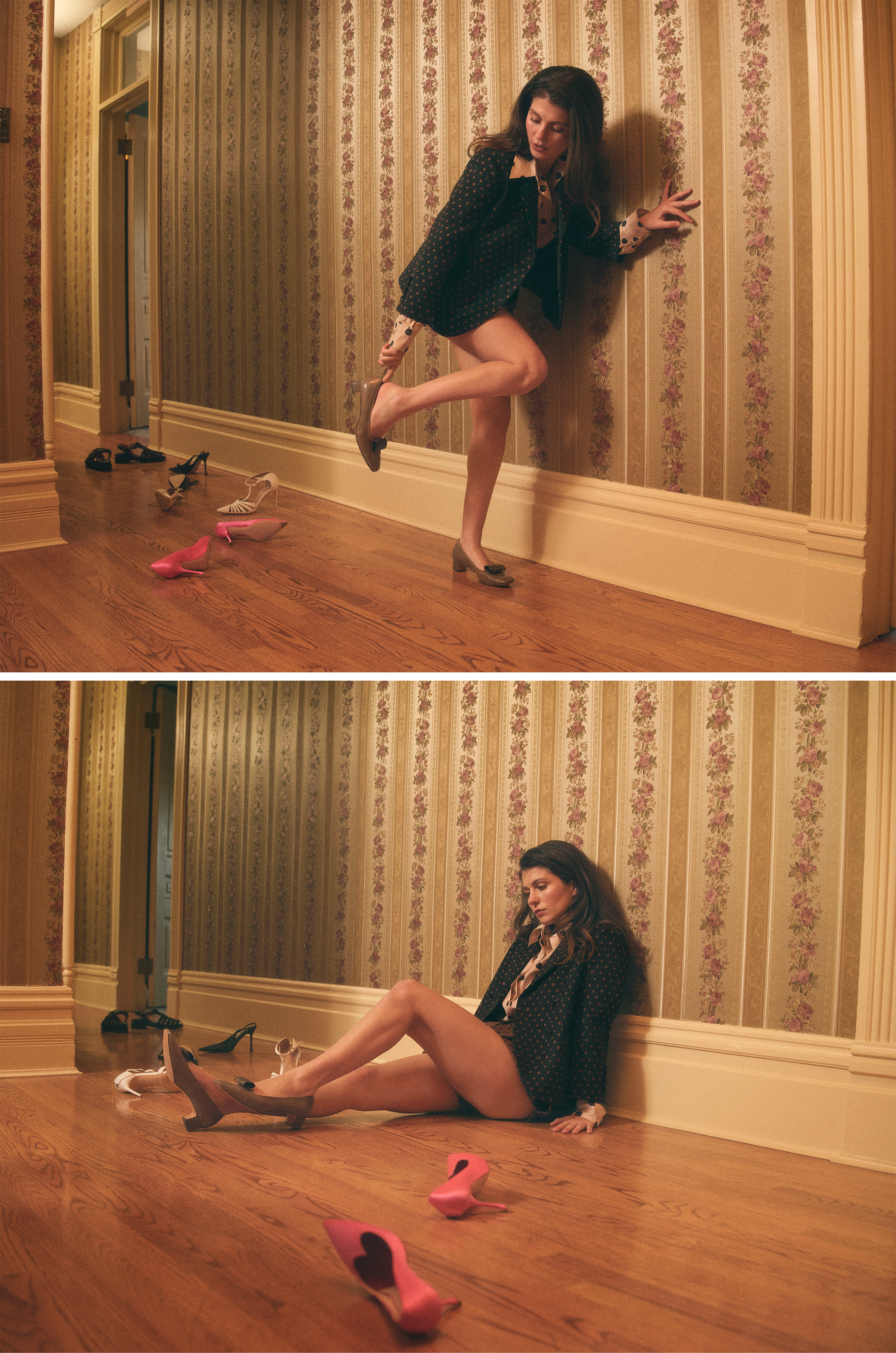 Emily Bader is photographed for Who What Wear's In Focus feature. Top image: She is seen leaning up against a floral print wall putting on her shoe. Bottom image: She is sitting on the floor up against the wall. In both images she is wearing a blazer jacket over a printed blouse and brown shorts.