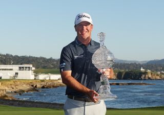 Tom Hoge holds the 2022 AT&T Pebble Beach Pro-Am trophy