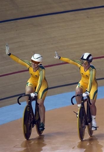 Australia's Anna Meares and Kaarle Mcculloch take a victory lap after winning the team sprint.