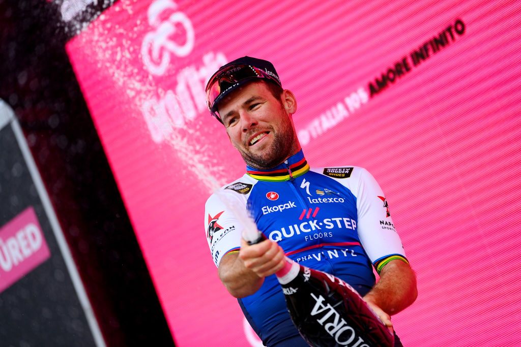 BALATONFURED HUNGARY MAY 08 Mark Cavendish of United Kingdom and Team QuickStep Alpha Vinyl celebrates winning the stage on the podium ceremony after the 105th Giro dItalia 2022 Stage 3 a 201km stage from Kaposvr to Balatonfred Giro WorldTour on May 08 2022 in Balatonfured Hungary Photo by Tim de WaeleGetty Images