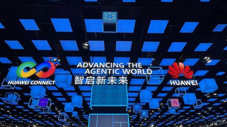 The colourful opening sign of Huawei Connect 2026 which reads "advancing the agentic world"