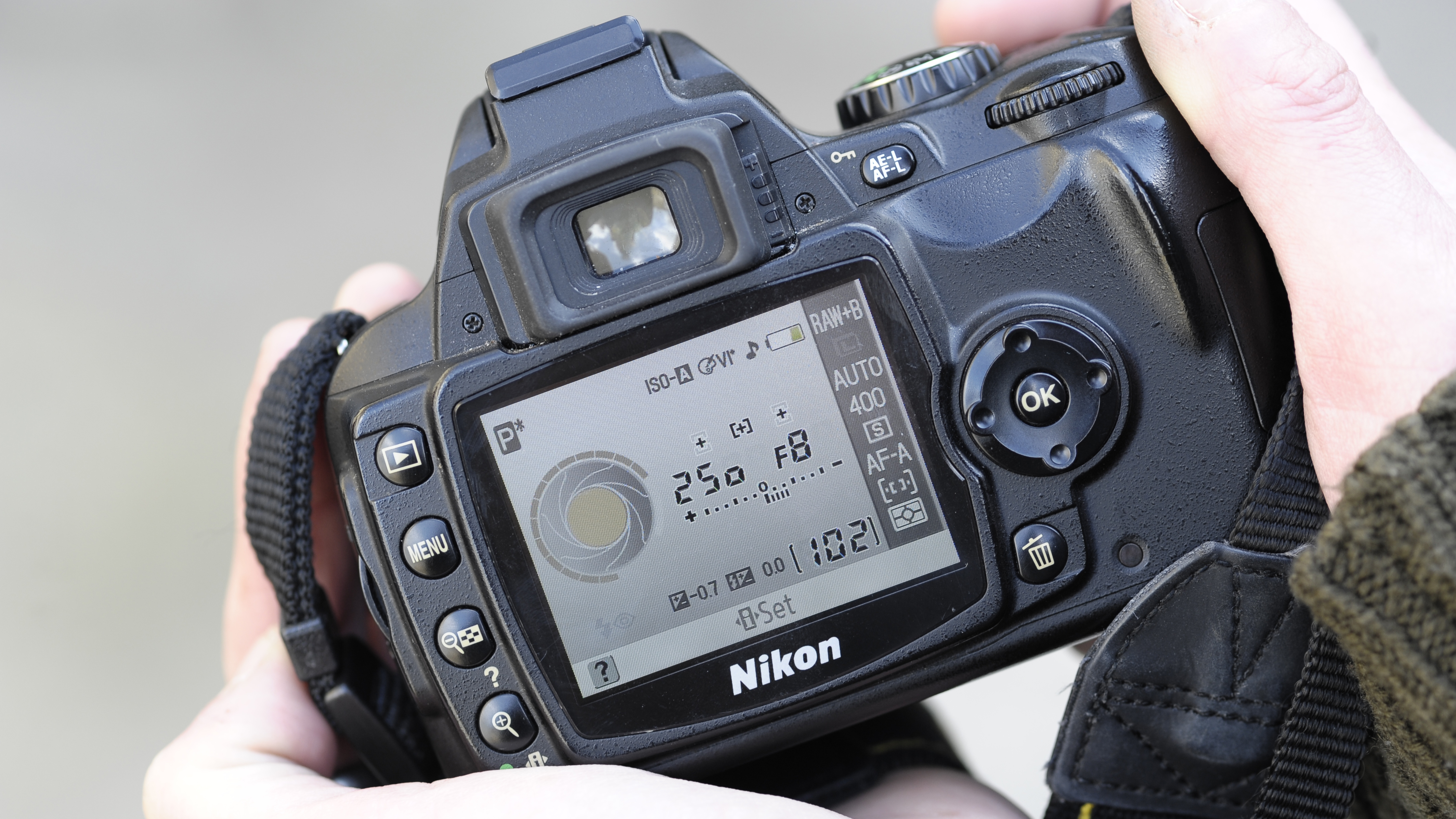 Nikon D40x being held in a photographer's hands