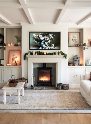 Christmas mantel with white surround and green garland