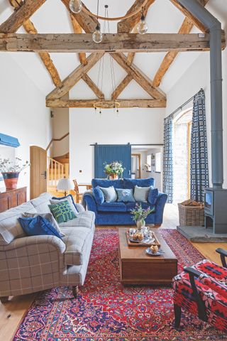 living room in barn conversion with exposed beams
