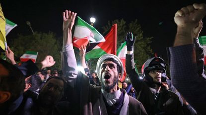 Demonstrators outside the British Embassy in Tehran following Iran's missile attack on Israel