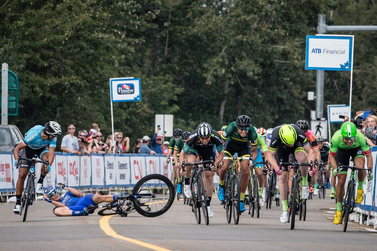 Travis McCabe hits the deck in a crash during stage 2 at the Tour of Alberta