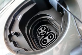 Type 1 CCS charging socket in a gray EV