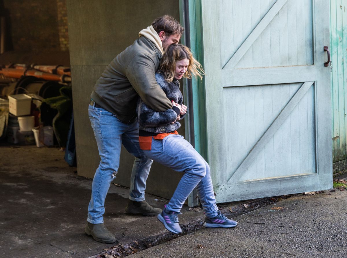 Dean grabs Abi Franklin and locks her in the garage.