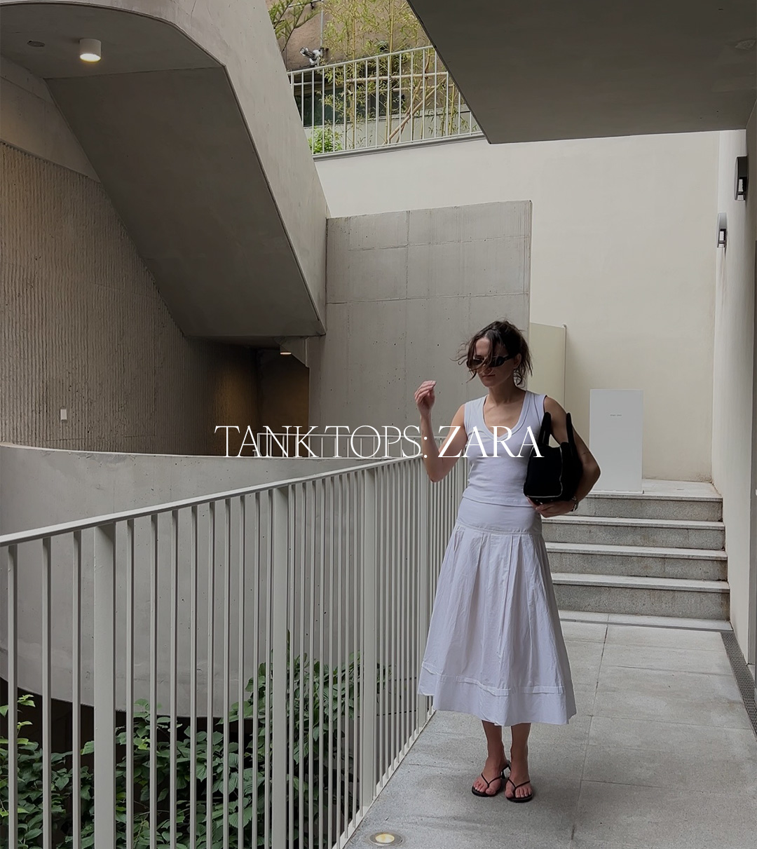 Eliza Huber wearing a white Zara tank top with a white skirt and black sandals. Text reads: "Tank Tops: Zara."