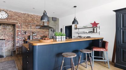 galley kitchen with white kitchen cabinets with pink floral blinds