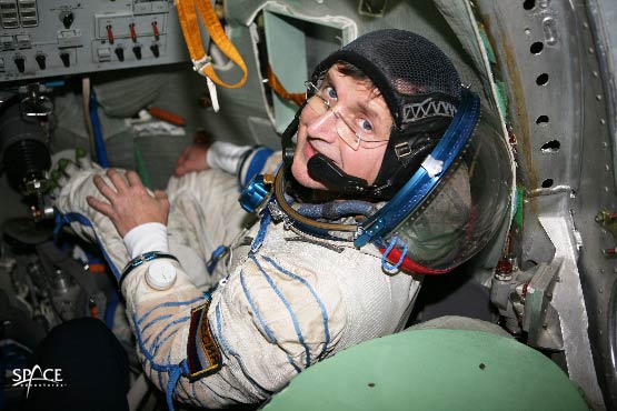 Space tourist Charles Simonyi trains inside a Soyuz spacecraft simulator before his first flight of April 2007. Simonyi launched on a second orbital mission in 2009, becoming the only two-time private space explorer.