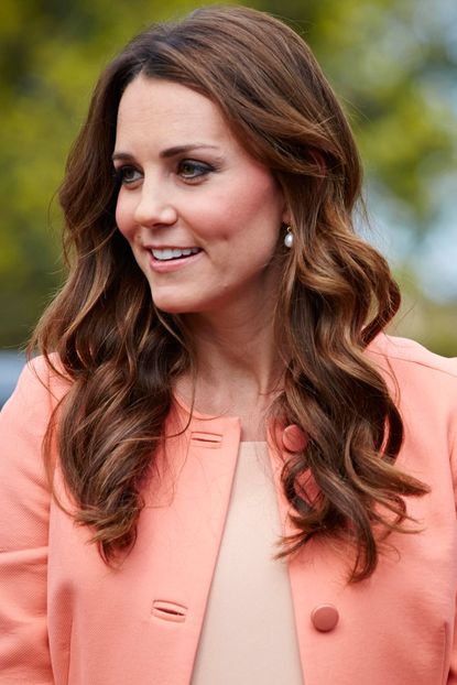 Kate Middleton wearing a peach-coloured coat