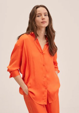 Kate Middleton's white suit—orange Mango blouse in similar shade to one worn by Kate. 