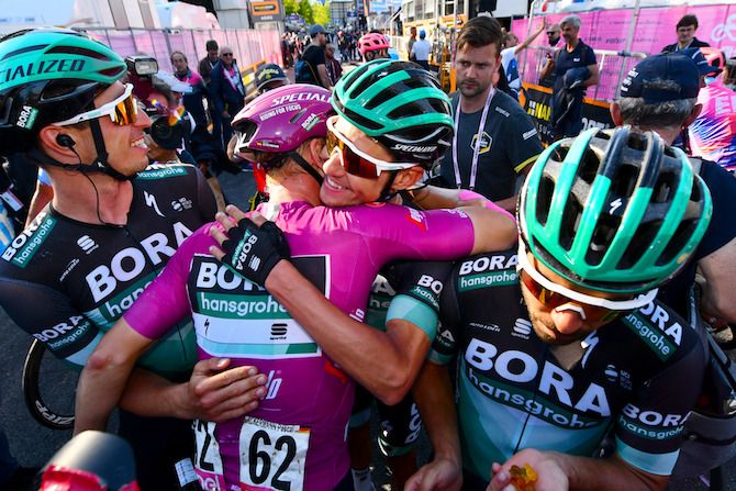 Pascal Ackermann is congratulated by his Bora-Hansgrohe teammates after sewing up victory in the points jersey competition at the 2019 Giro d'Italia