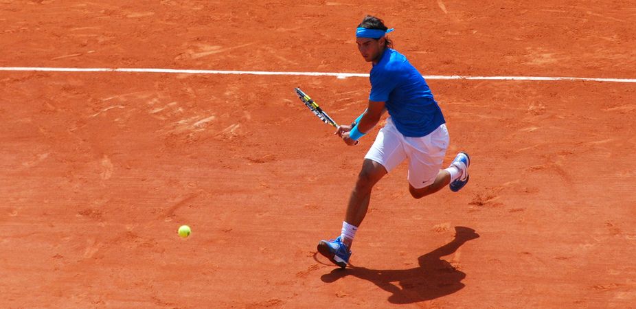 Rafael Nadal playing tennis, success