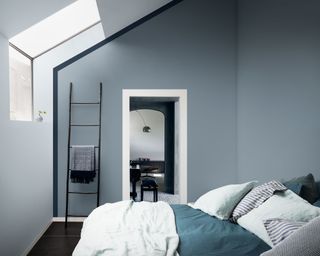blue bedroom by Dulux with open doorway
