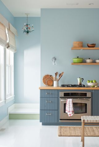 blue room design ideas in a retro kitchen with cabinets painted in Benjamin Moore Normandy