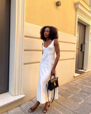 White linen dress with black sandals