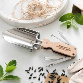 best gifts for gardeners multipurpose trowl with pen knife and tools hidden in the handle