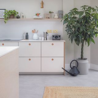 White scandi kitchen with grey concrete floor