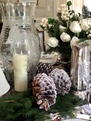 pine cone and christmas foliage centerpiece table display