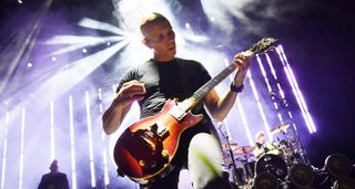 Billy Howerdel of A Perfect Circle performs onstage with a Gibson Les Paul