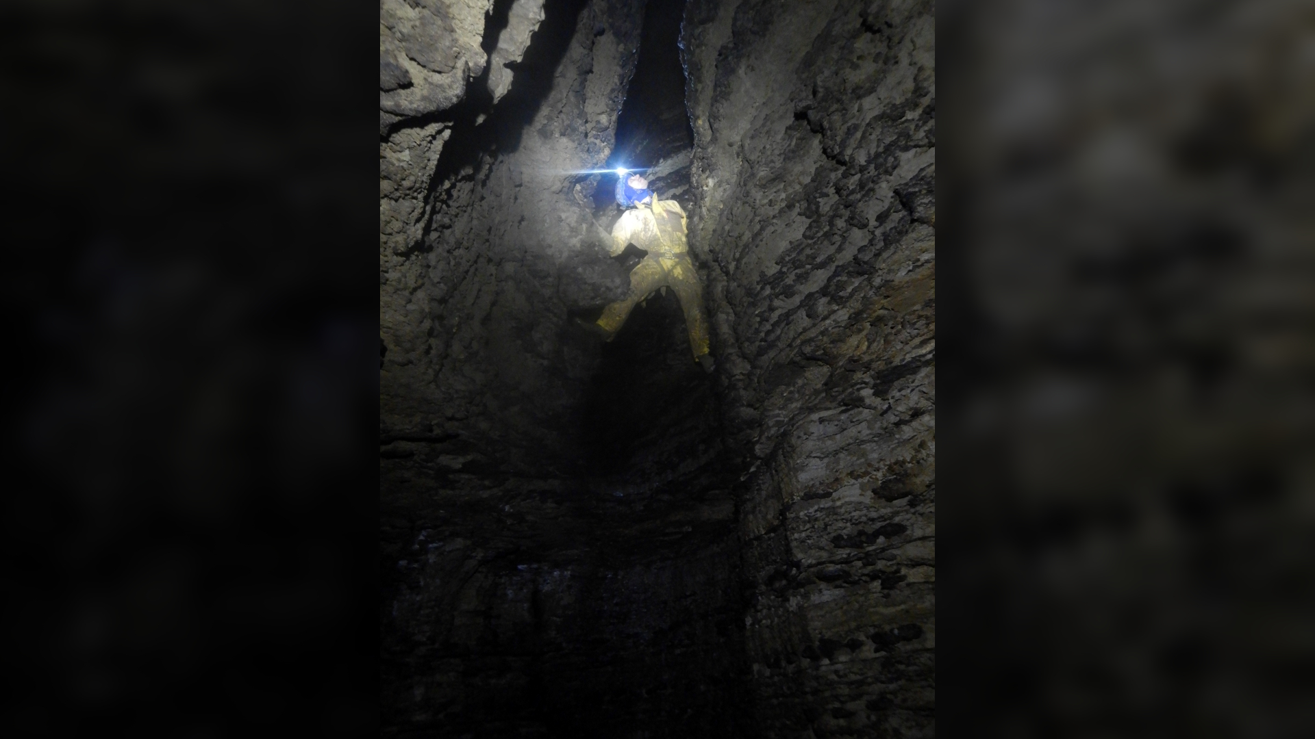 A caver exploring Australia's deepest cave.