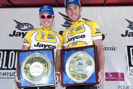 Series winners Rochelle Gilmore of Team Honda and Matt Goss of the E3 Pure Tasmania team on the podium in Williamstown with their trophys.