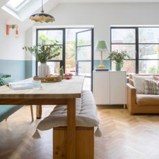 Dining room area with bench dining room table and crittal doors heading out into the garden