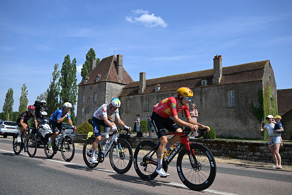 Julian Alaphilippe of Tudor Pro Cycling, Nelson Oliveira of Movistar, Mathis Le Berre of TotalEnergies and Anthon Charmig of Uno-X Mobility compete in the breakaway