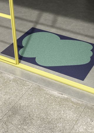 A doormat in blue and emerald by Sightunseen, presented during New York Design Week 2024