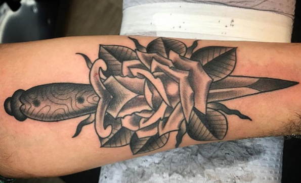 Rose and dagger tattoo