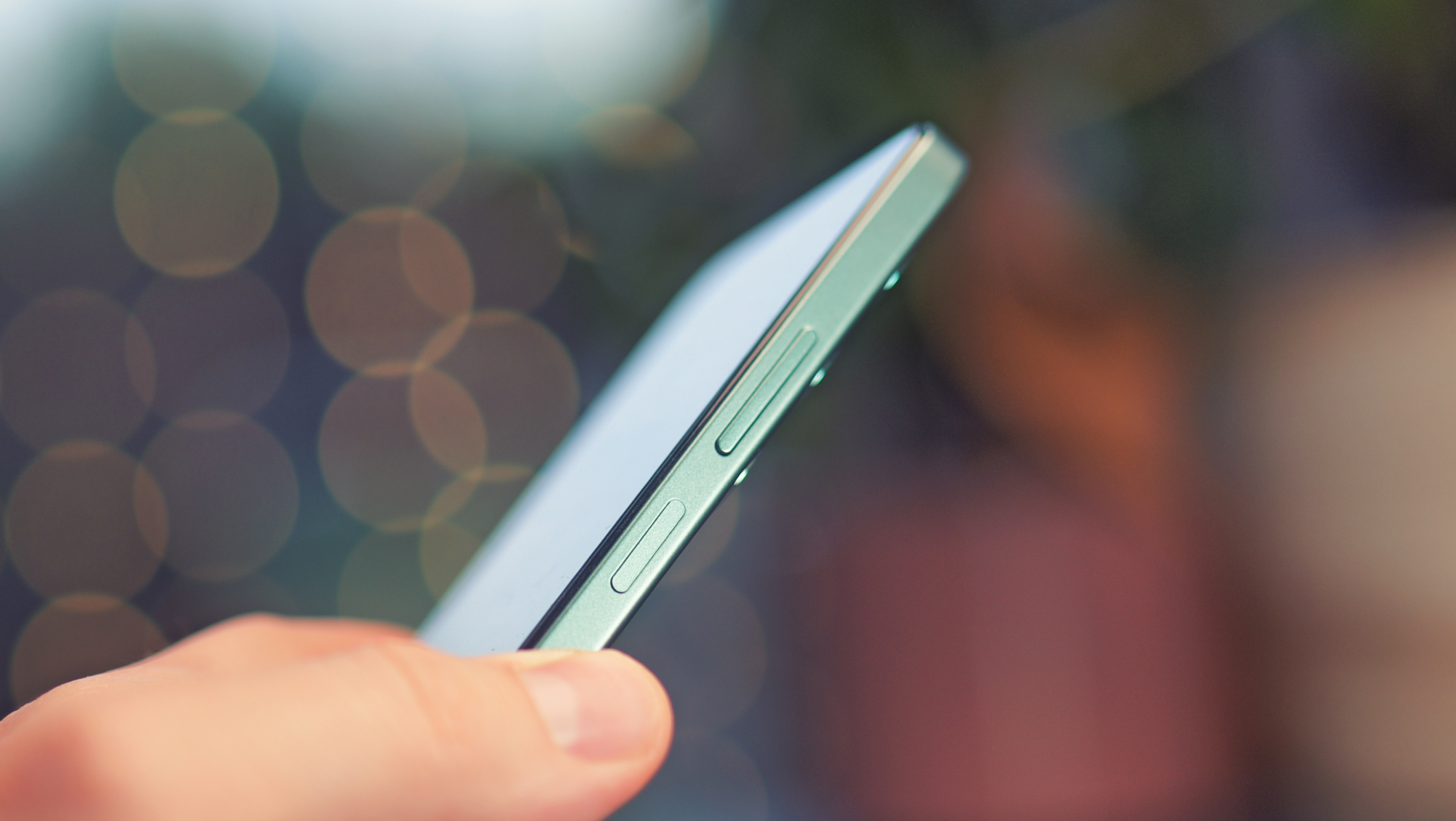 Oppo A5 5G phone held in a hand