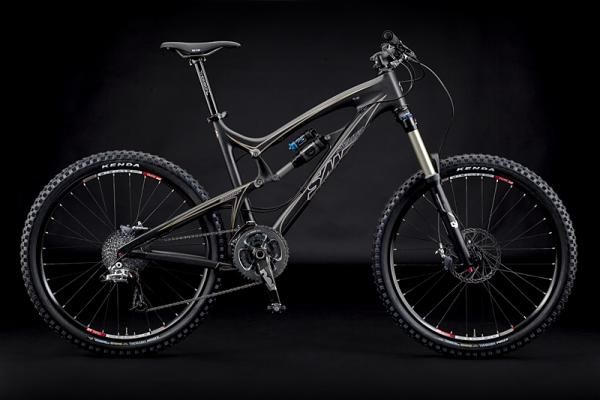 The Santa Cruz Nomad with a carbon frame. This version is black with gold trim.