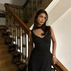 Mishti Rahman with glossy, gently curled hair, and bronzed makeup