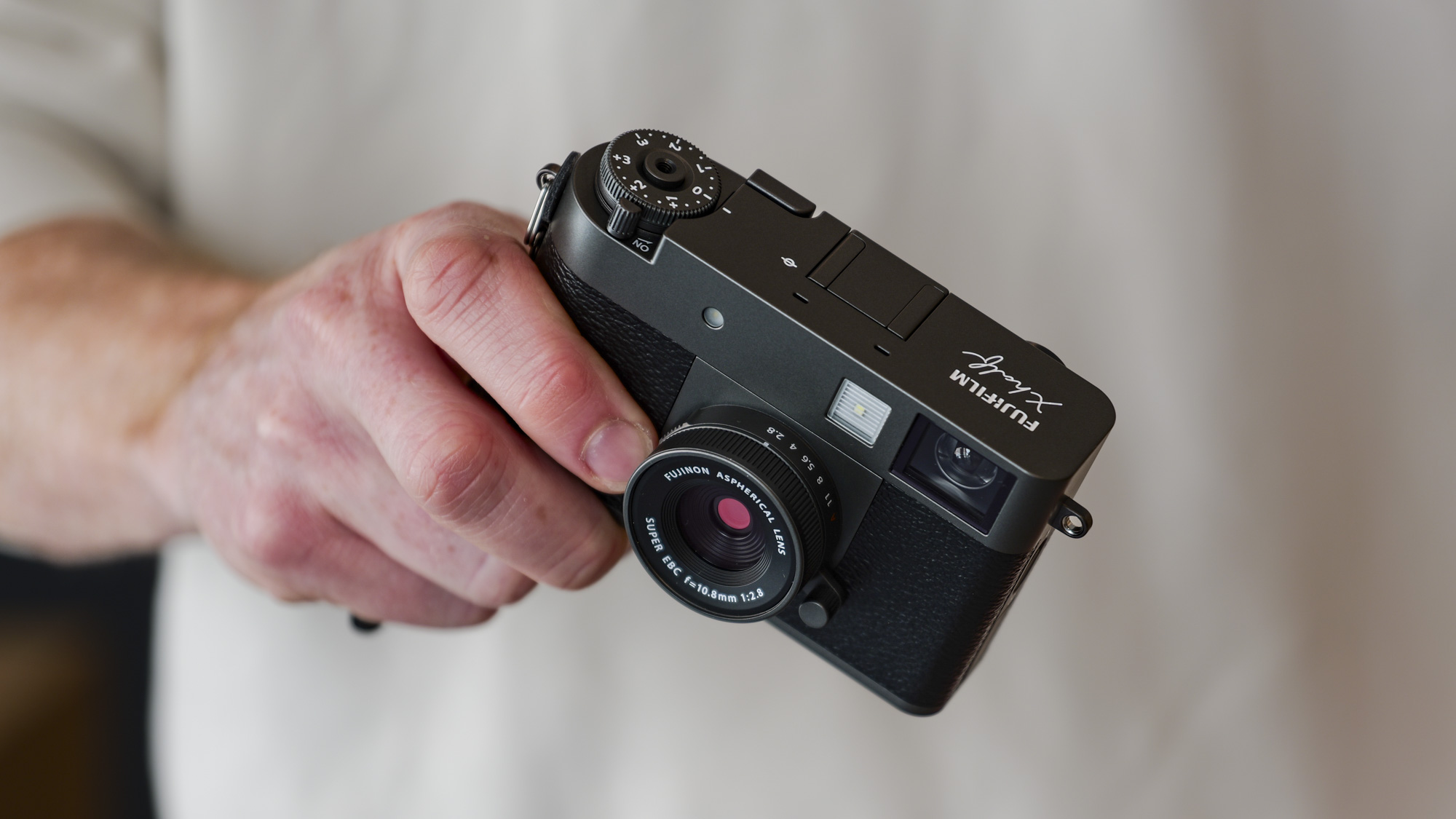 Fujifilm X half compact camera in the hand