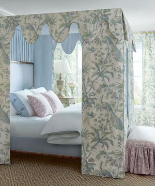 bedroom with fabric fourposter bed in pattern