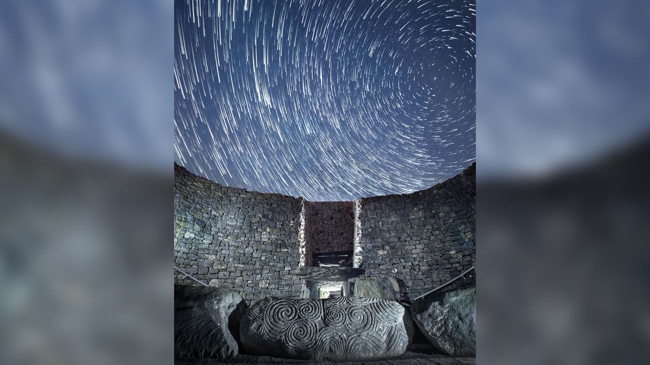 The circular Newgrange passage tomb on a misty morning in Ireland's Boyne Valley. Scientists say it contained the bones of a Neolithic man, probably a king whose parents were brother and sister.