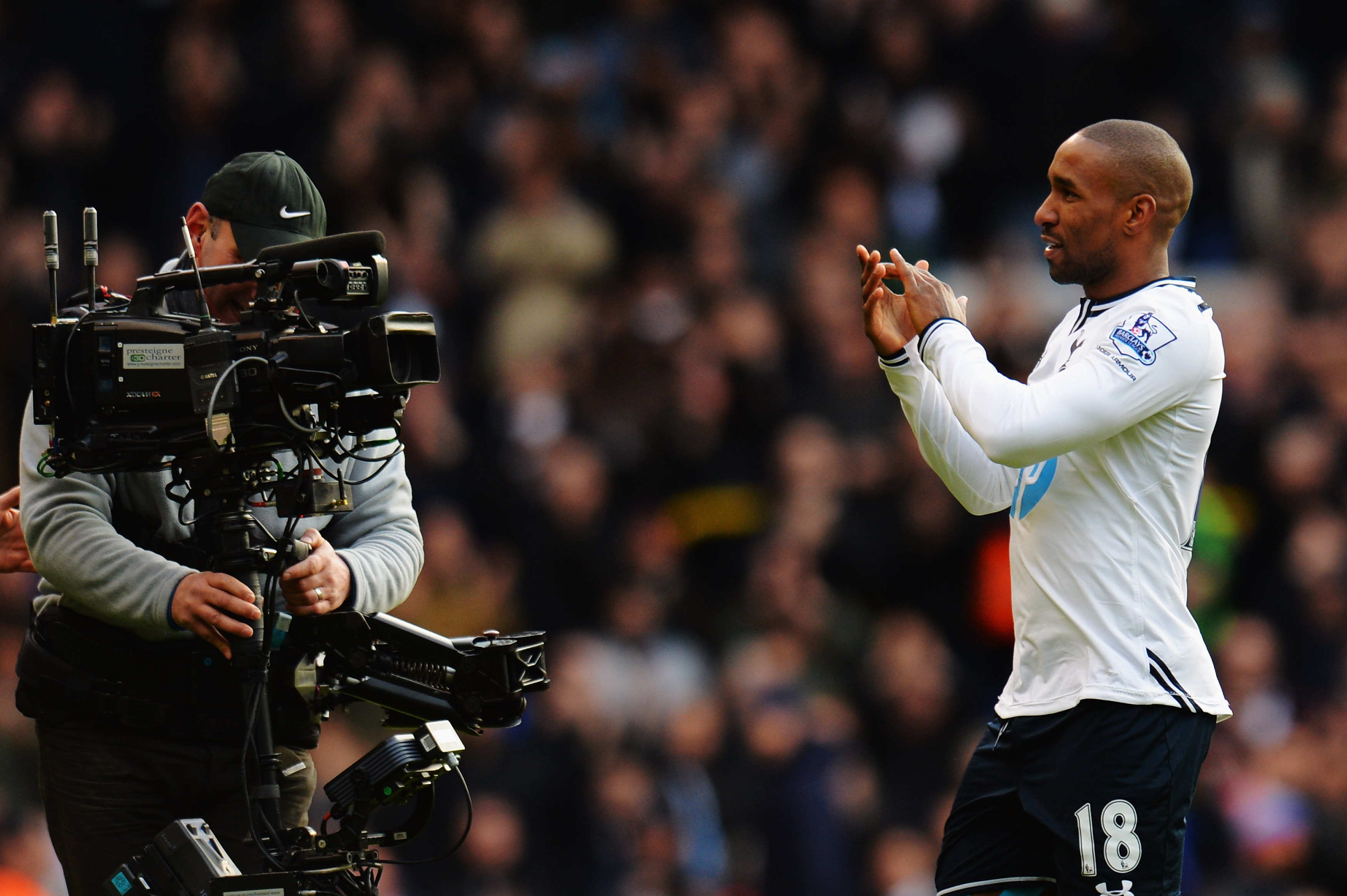 Jermain Defoe applauds the Tottenham fans at the end of his final home game for the club at White Hart Lane, against Everton in 2014.
