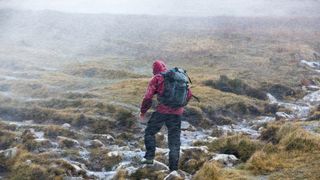 what to do if you get lost hiking: man in rainstorm