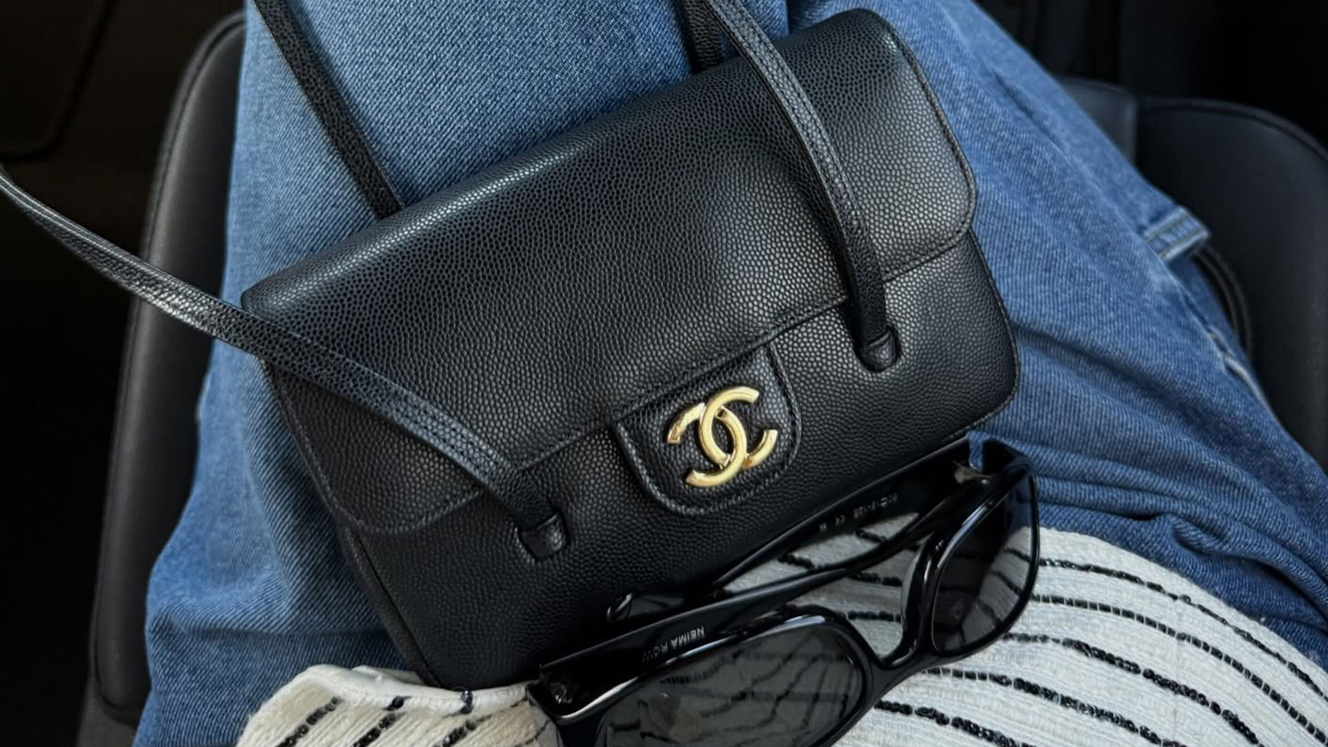 @hoskelsa closeup shot of chanel shoulder bag and sunglasses
