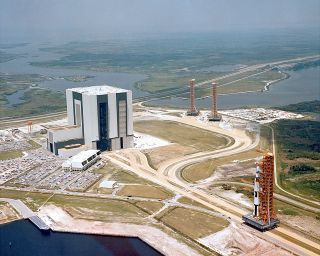 The Apollo Saturn V 500-F facilities demonstrator is seen from the air departing the Vehicle Assembly Building (VAB) for the launchpad at NASA's Kennedy Space Center in Florida. (NASA)